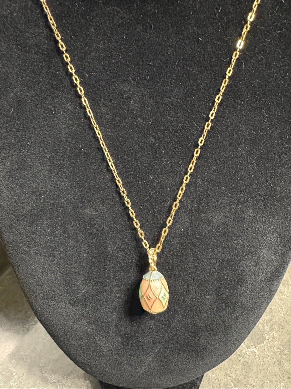 Avon Gold-Tone Enamel Egg Pendant Necklace with rhinestones. Chain has extension